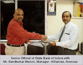 Senior Official of State Bank of Indore with Mr. Nandkumar Menon, Manager - Alliances, Avenues Senior Official of State Bank of Indore with Mr. Nandkumar Menon, Manager - Alliances, Avenues